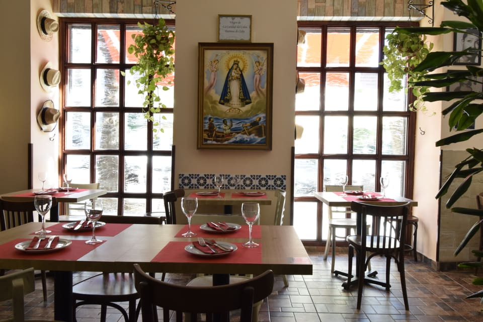 The windows, the tiles and the painting of the Virgin of Charity